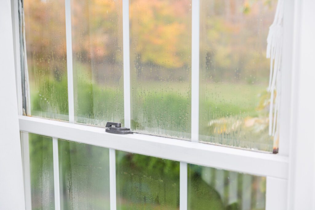 A picture of a window with rain on it.