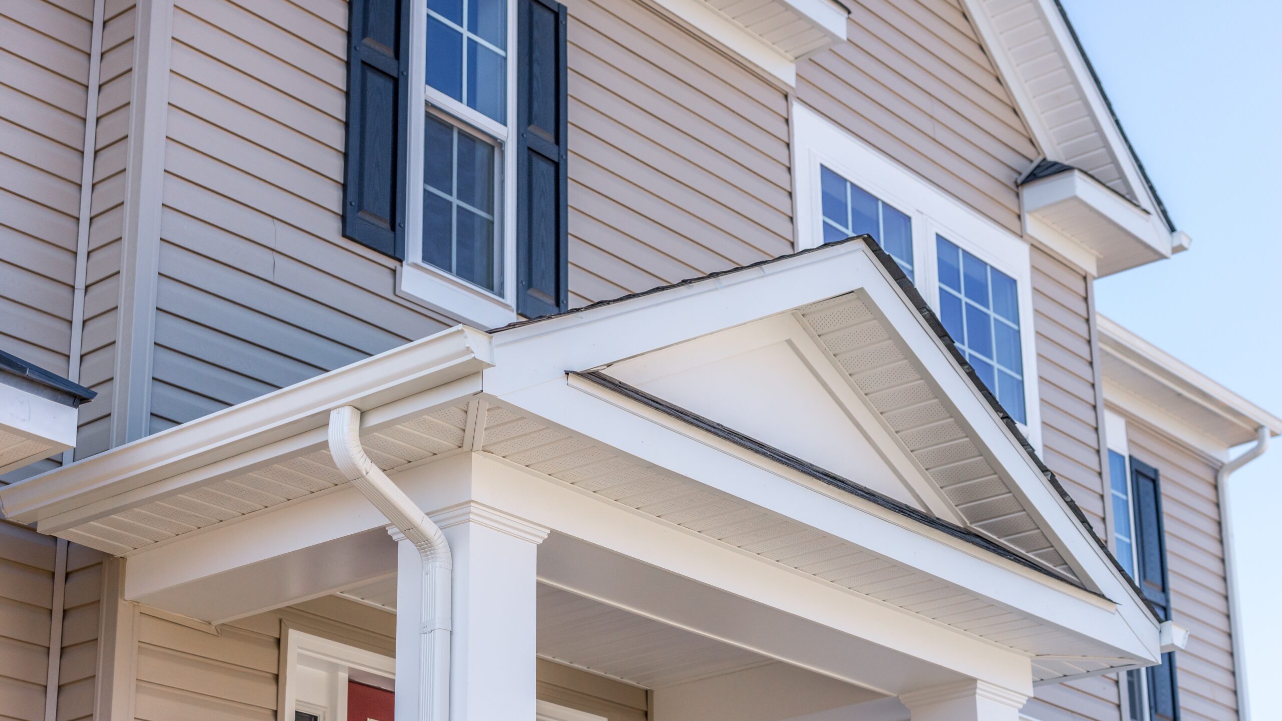 Closeup of a home with beige siding