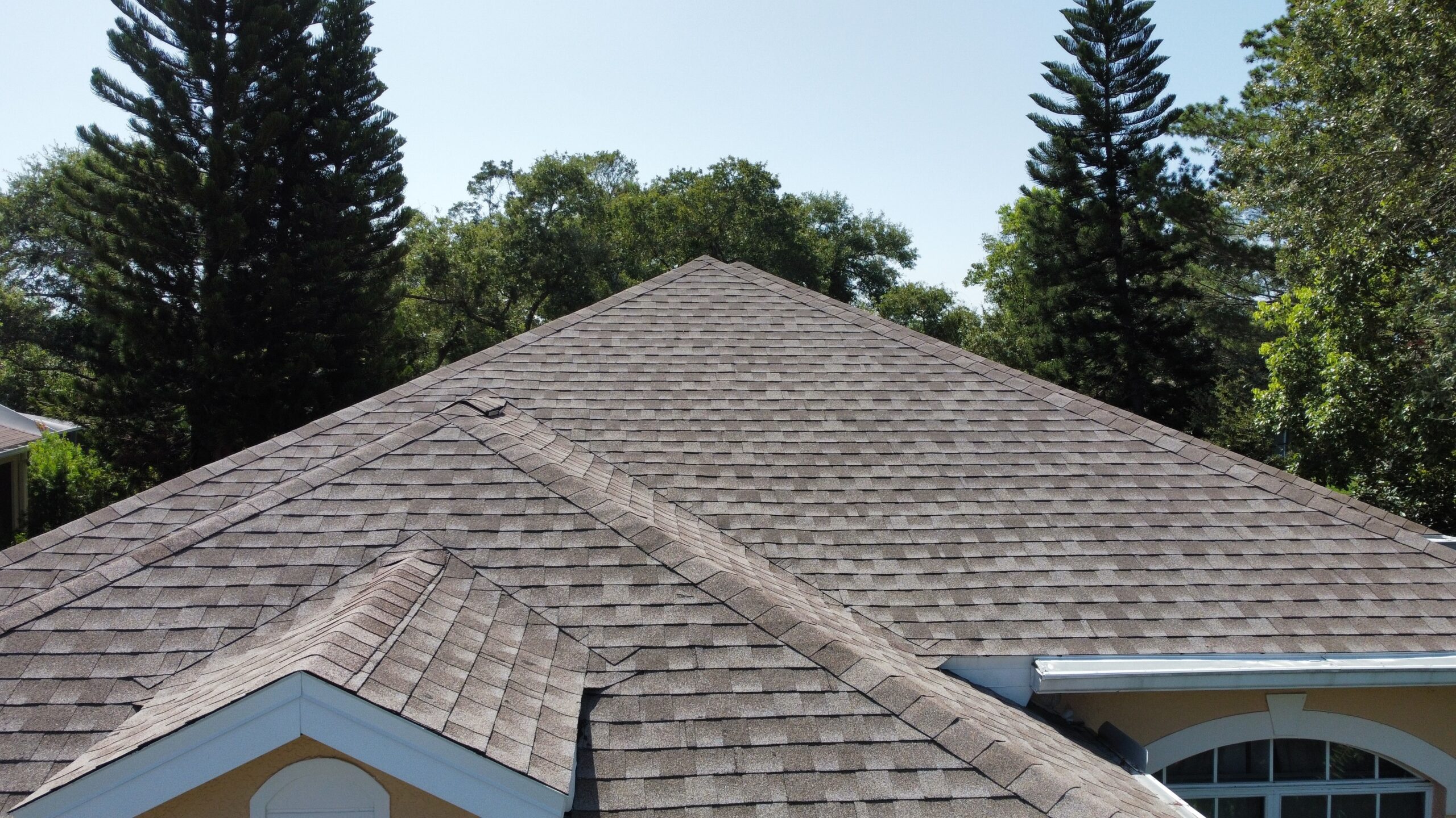 Closeup of a newly installed gray shingle roof