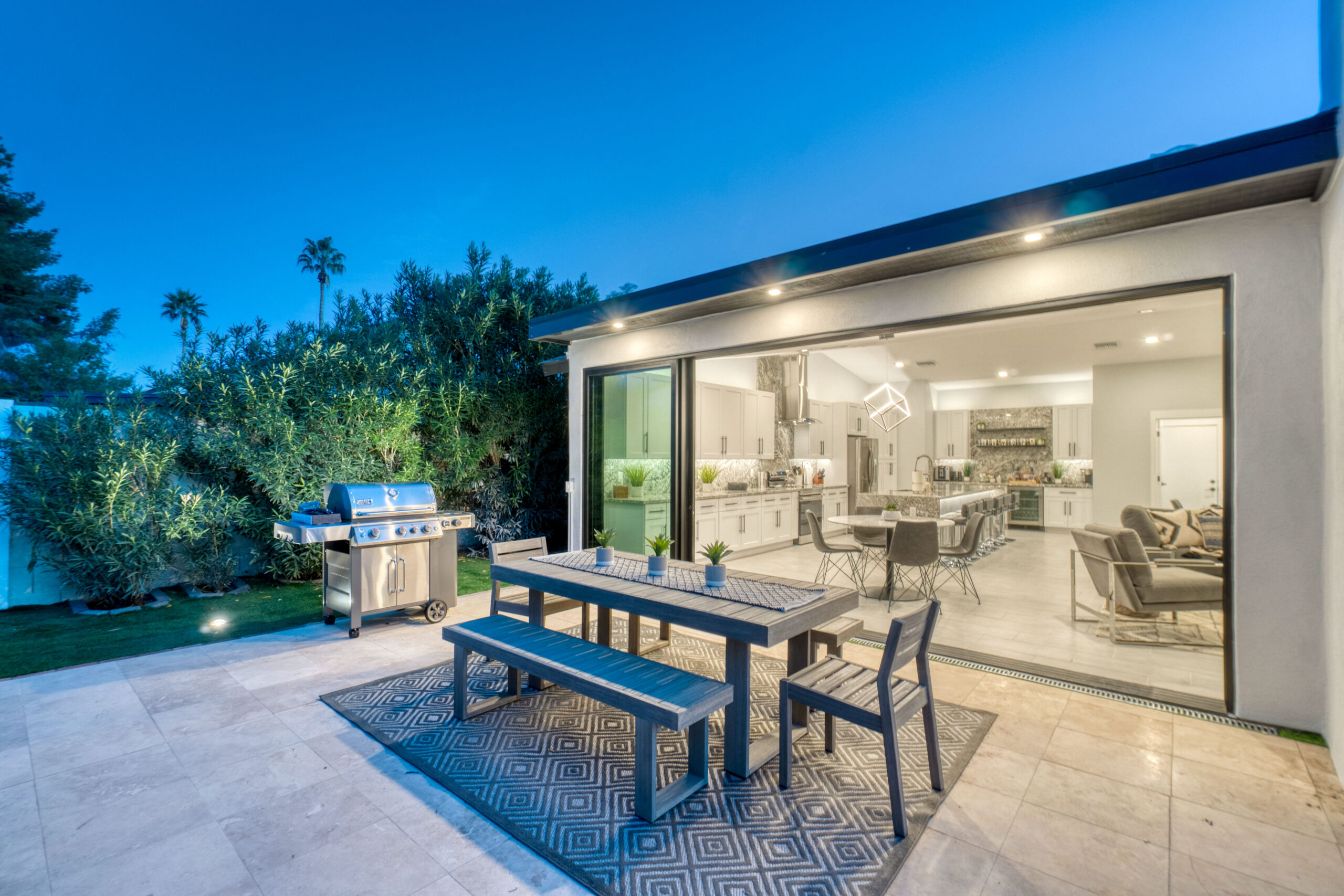 There is a glass patio door and a table