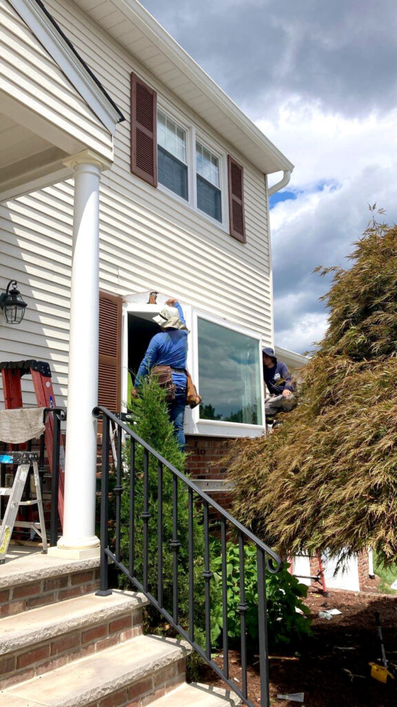 The RJW Exteriors team replaces a customer’s windows