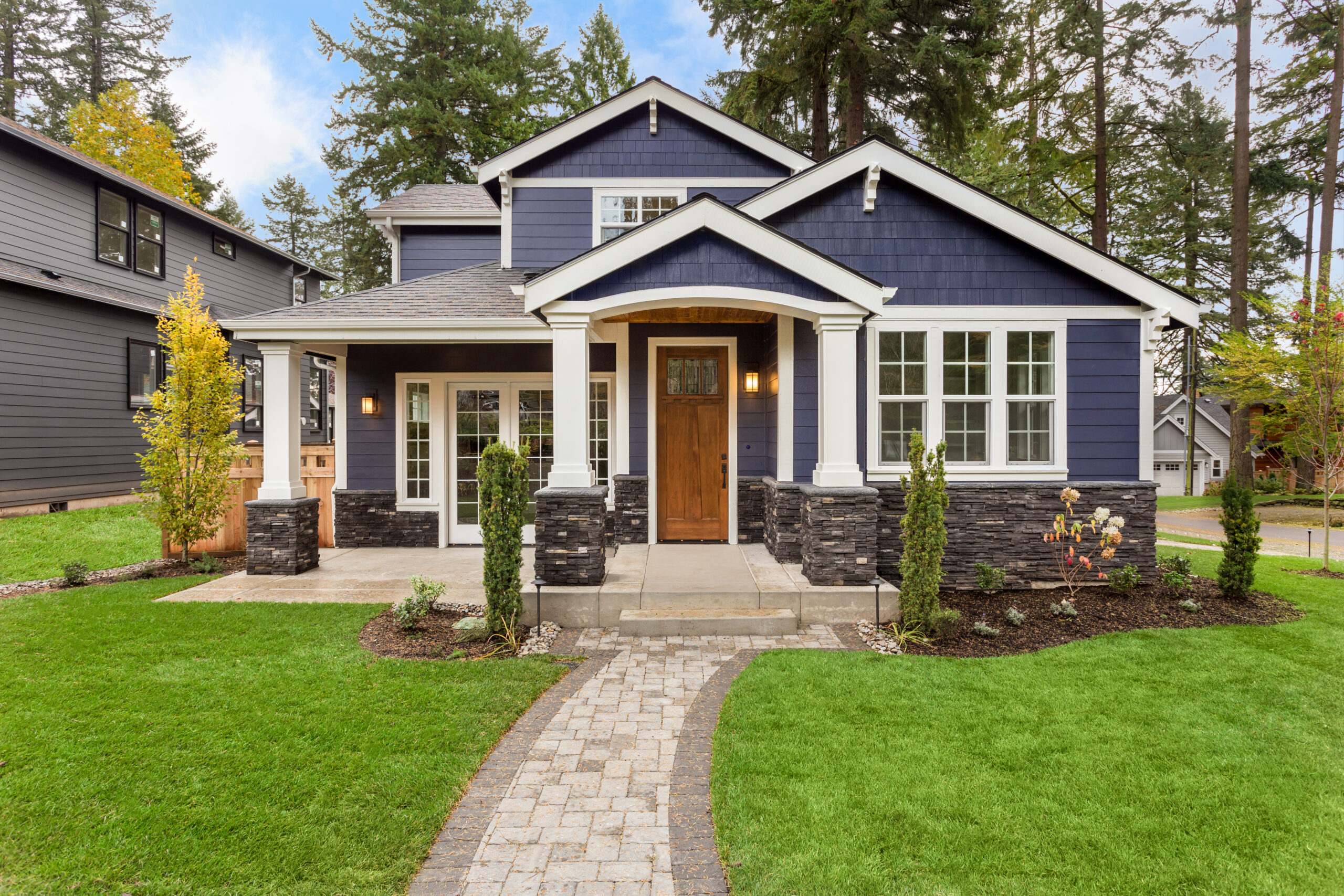 There is a beautiful navy blue home