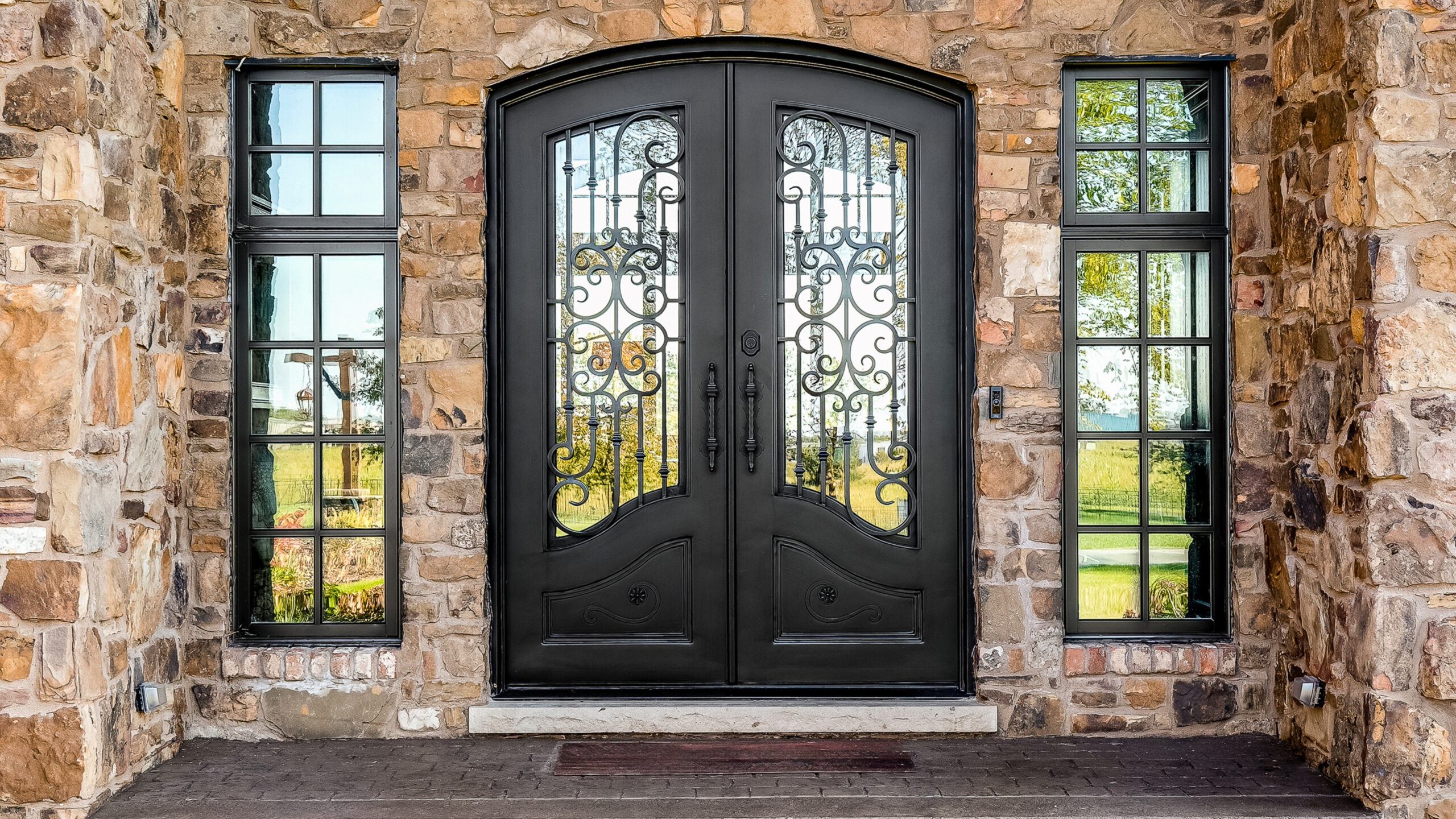 Decorative black entry door on home