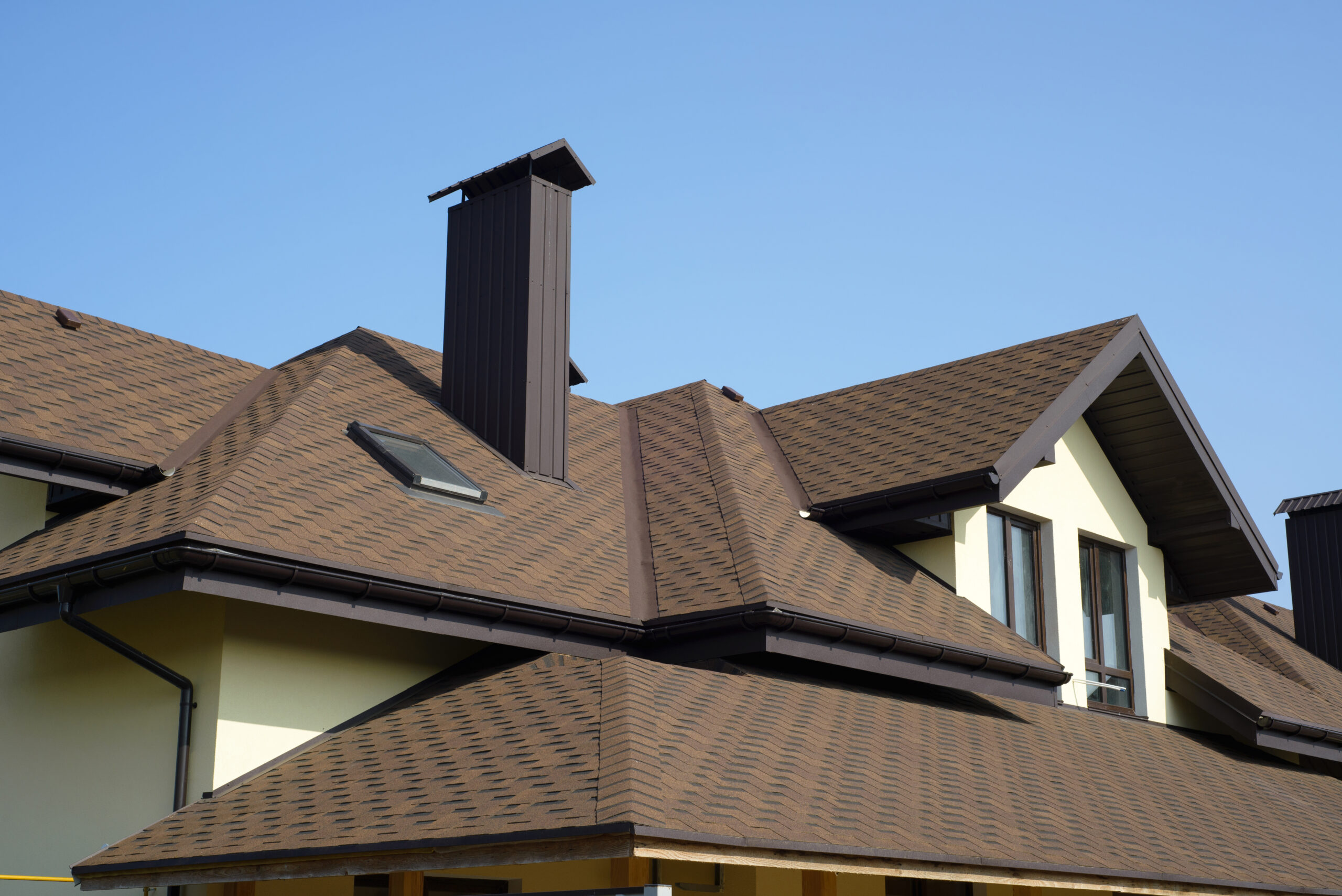 There is a fresh brown roof on a home