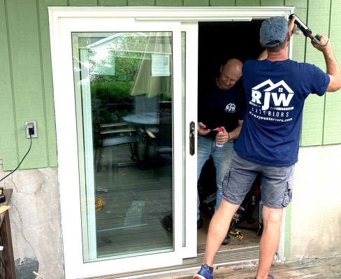 The RJW Exteriors team installs a brand-new patio door