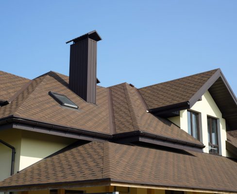 There is a fresh brown roof on the home